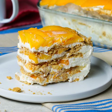 This Filipino icebox dessert consists of layers of graham crackers, sweetened whipped cream, and ripe mango. Be sure to chill everything, especially the cream, condensed milk, glass dish, mixing bowl, and beaters for the mixer. This will help the cream whip more quickly and everything come together well during assembly. Thaw the float before serving, or serve slightly frozen. Enjoy with your favorite dessert wine, cocktail, coffee or tea! Mango Float Filipino, Mango Float Recipe, Mango Graham Cake, Graham Dessert, Mango Graham, Graham Cake, Mango Float, Icebox Desserts, Float Recipes