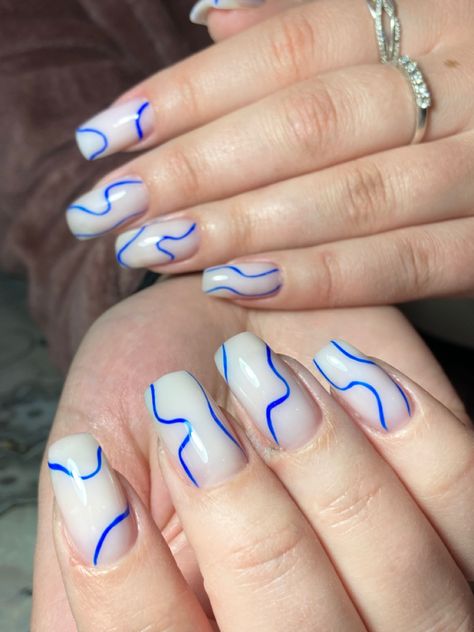 Blue And White Wavy Nails, White Nails With Blue Lines, Milk Nails With Design, Blue Nails With Lines, Blue Lines Nails, Wavy Blue Nails, Milk Nails Design, Milk White Nails Design, Blue Line Nails