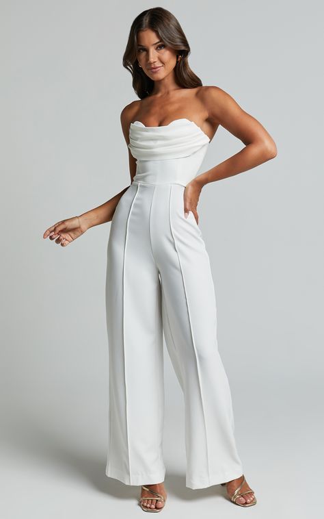 Get ready to turn heads and steal the spotlight in our Stacey Jumpsuit! This strapless cowl wide leg jumpsuit in off white is the perfect choice for any occasion, whether it's a cocktail party or a night out with friends. The sweetheart neckline adds a touch of femininity, while the wide leg design gives you an effortlessly chic look. Made from spandex and polyester, this jumpsuit is not only comfortable to wear but also has just the right amount of stretch to flatter your silhouette. So go ahea White Jumpsuit Strapless, Jumpsuit For Graduation For Women, Sweetheart Neckline Jumpsuit, Outfit For Going Out With Friends, White Jumpsuit Graduation, All White Outfit Women, Graduation Jumpsuit Outfit, Graduation Jumpsuit, College Graduation Outfit