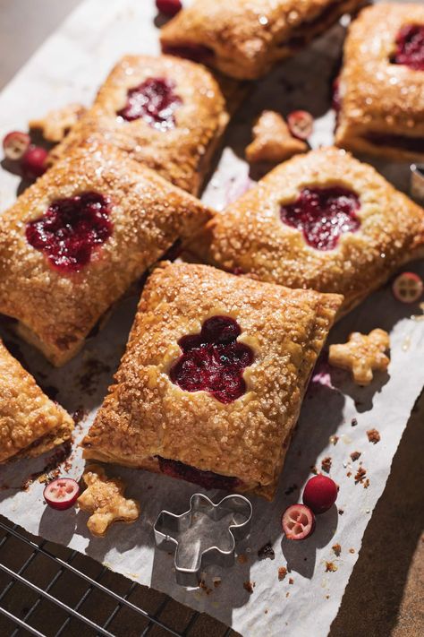 These cranberry hand pies are made with a super crispy and flaky pie crust and filled with a tart cranberry filling. They're everything you love about pie but in a tiny handheld pastry! #handpies #pie #cranberry | teakandthyme.com Small Pies, Cranberry Filling, Hand Pie, Flaky Pie Crust, Sugar Crystals, Hand Pies, Pie Dough, Baking Sweets, Cranberry Sauce