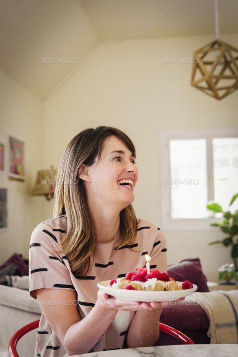 A woman holding a plate with dessert and a lit candle. by Mint_Images. A woman holding a plate with dessert and a lit candle. #Sponsored #plate, #holding, #woman, #dessert Holding A Plate, Photos Background, Hands Holding, Food Photo, Drawing Reference, Hold On, A Woman, Mint, Dessert