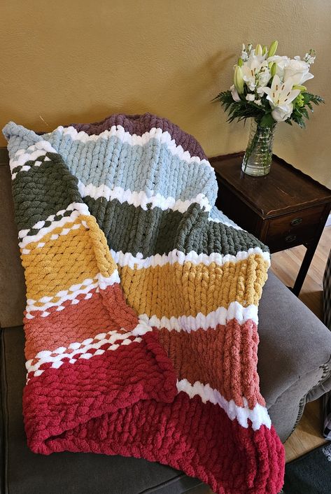 Celebrating Love is Love! Wrap yourself in the luxurious warmth of our handmade Chunky 40x50 Blanket, knitted with soft and snuggly Chenille yarn. This oversized blanket is perfect for those cozy moments on the couch, reading a book, or watching your favorite movie. The chunky knit design adds a touch of texture and style to any room, making it a must-have addition to your home decor. Whether you're looking for a warm and comforting gift or a treat for yourself, our Chunky Blanket is the perfect choice. Indulge in the ultimate comfort with this beautifully crafted, hand-knitted creation. *PLEASE NOTE: Measurements may vary slightly due to the handmade nature of all products to the natural shift in yarn. **Cleaning Instructions : Machine wash cold on delicate cycle, Lay flat to dry or Tumbl Chunky Knit Blanket Stripes, 2 Color Chunky Knit Blanket, Chunky Knit Blanket Color Combos, Crochet Chenille Blanket, Chunky Knit Blanket Pattern, Hand Knitted Blanket, Chunky Blankets, Fil Chenille, Blanket Knitted