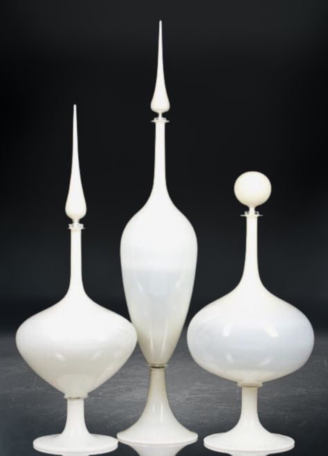 "Introducing the 'Timeless Elegance' set - a trio of exquisitely crafted , handmade white glass decanters with stoppers that embody classic vintage style. Each decanter in this set is a testament to the timeless beauty of artisanal craftsmanship, meticulously designed to exude sophistication and refinement. Crafted with care and precision, these handblown glass decanters showcase a pristine white hue that adds an air of grace to any setting. The stoppers, crafted with the same attention to detail, provide a perfect seal, preserving the rich aromas and flavors of your favorite spirits. This set of three decanters is not just a functional addition to your barware collection but a statement piece that effortlessly blends elegance with practicality. Whether adorning your home bar, dining table Bay Window Living Room, Classic Vintage Style, Bar Displays, Organic Forms, Unique Vases, Glass Decanter, Updating House, Decanters, Red Glass