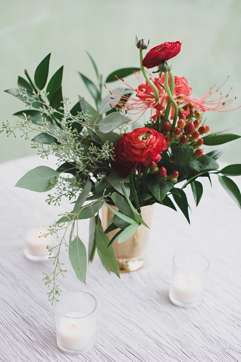 ranunculus and berry centerpiece, photo by Jon Schaaf Photography http://ruffledblog.com/intimate-charlottesville-wedding #weddingideas #centerpieces Eucalyptus Floral Centerpiece, Red White And Green Flower Arrangements, Red And Green Floral Arrangements, Red And Green Flower Arrangements, Red And White Flower Arrangements, Christmas Flower Centerpieces, Red Flower Centerpieces, Red Floral Arrangements, Simple Floral Arrangements