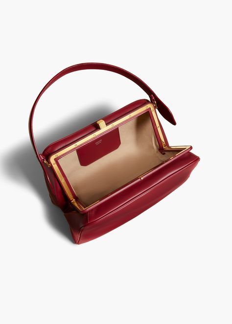 Structured by a covered frame, this top-handled silhouette is at once intricate and nimble. With custom kiss-lock clasp plated in 18-karat gold. Build Wardrobe, Oxblood Leather, Fall Handbags, What In My Bag, Belt Accessories, Built In Wardrobe, Oliver Peoples, Fall Shopping, Fall 2024