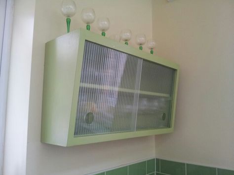 My upcycled retro vintage kitchen wall units, painted green, with reeded glass sliding doors. Kitchen Cabinet Glass Doors, Hallway 2023, Repurposed Kitchen, Kitchen Wall Units, Funky Kitchen, Glass Cupboard, Cabinet Glass Doors, Wooden Kitchen Cabinets, Glass Sliding Doors