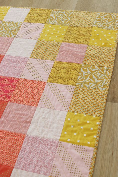 A coral, pink and yellow simple squares quilt pattern – a quick and easy free baby quilt pattern using 5 inch squares. The Sweet and Simple Squares quilt pattern by Bonjour Quilts is an easy quilt pattern to make in a day. It’s scrap compatible and fat quarter friendly, so it will be a great stash buster quilt. Perfect for a some handmade nursery décor. Fat Quarters Baby Quilt, Easy Quilt Patterns Free, Quilts Using Fat Quarters, Squares Quilt Pattern, Baby Quilts Easy, Baby Quilts To Make, Quilt Top Patterns, Baby Quilt Patterns Easy, Charm Pack Quilt Patterns