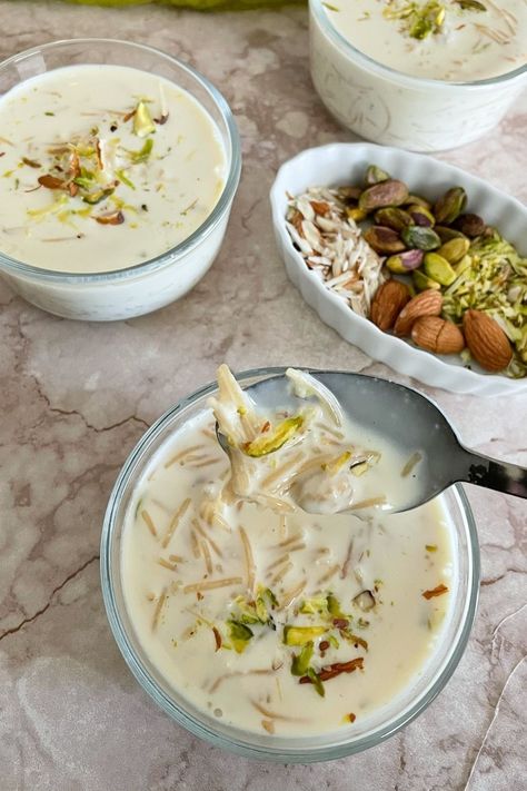 Sheer Khurma is a classic and easy Pakistani dessert recipe. This sheer khurma for Eid celebrateions. This sheer khurma recipe is made with roasted vermicelli cooked in milk infused with nuts, saffron, and cardamom is an easy indian dessert recipe to make at home! Enjoy this sheer khurma, a traditional Pakistani / Indian sweets recipe, either chilled or warm for the perfect Pakistani dessert for Eid. Vermicelli Pudding, Pakistani Desserts, Easy Indian Dessert Recipes, Sheer Khurma, Easy Indian Dessert, Eid Ideas, Kheer Recipe, Eid Food, Appetizers For A Crowd