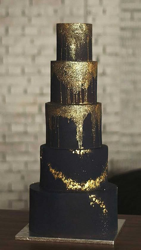 Wedding cakes are an iconic part of a big-day reception.  There’s nothing like a beautiful wedding cake, that looks almost too pretty to cut into.  Check... Gothic Wedding Cake, White And Gold Wedding Cake, Black And Gold Cake, Rose Gold Wedding Cakes, Black And Gold Theme, Black And Gold Wedding, Pretty Wedding Cakes, Black Gold Wedding, Black Wedding Cakes