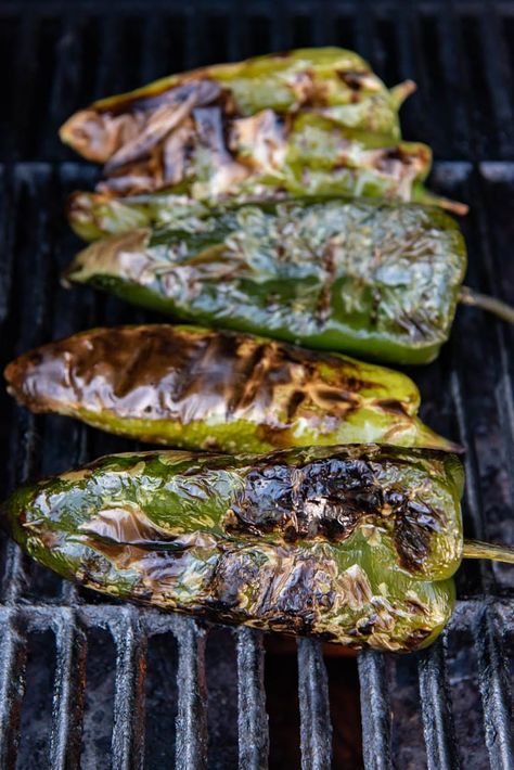 Grilled poblano peppers that have been roasted on a grill over a flame until the skins are charred. Southwest Burger, Pantry Recipe, Poblano Peppers Recipes, Cheese Empanadas, Hatch Chiles, Roasted Poblano Peppers, Hamburgers Grilled, Stuffed Anaheim Peppers, Hatch Green Chile