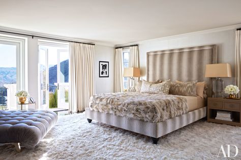 A bespoke bed upholstered in a Colefax and Fowler fabric punctuates the master bedroom of Khloe Kardashian's California house, with a Fendi throw and aplaca carpet adding cozy accents to the space. | archdigest.com Khloe Kardashian Bedroom, Kardashian Bedroom, Kardashians House, Khloe Kardashian House, Celebrity Bedrooms, Calabasas Homes, Kardashian Home, Bespoke Beds, Dreamy Bedrooms