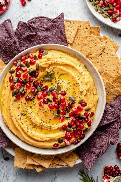 This homemade Roasted Butternut Squash Hummus is pure fall goodness! Loaded with butternut squash, roasted garlic, chickpeas, & tahini, this smooth & creamy hummus takes less than 45 minutes to make from scratch. Garnish with pepitas & pomegranate seeds for a festive touch, & it's the perfect fall appetizer for game day, holiday parties, & everything in between! Naturally vegan & gluten-free. #butternutsquash #fallrecipes #hummus #vegan #glutenfree #footballfood Butternut Squash Appetizer, Squash Appetizers, Butternut Squash Hummus, Vegan Fall Recipes, Squash Hummus, Finger Sandwich, Creamy Butternut Squash, Homemade Appetizer, Pumpkin Hummus