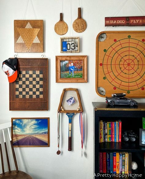 vintage game gallery wall small updates in the kids' bedrooms Vintage Gameroom, Vintage Game Room Decor, Game Room Gallery Wall, Vintage Game Decor, Basement Wall Games, Vintage Basement Decor, 70s Game Room, Board Game Wall, Boys Room Gallery Wall