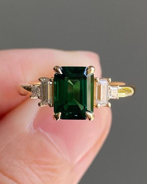 Five Stone Art Deco Diamond Ring, 2CT Green Emerald Center Engagement Ring, Princess & Baguette Cut Retro Ring, Gift For Her, 14K Gold Ring Item Description: Main Stone - Simulated Diamond Main Shape-  Emerald Cut  Side Stone- Simulated Diamond Side Stone Shap- Princess & Baguette 1. White Gold: 10K/14K/18K 2. Yellow Gold: 10K/14K/18K 3. Rose Gold: 10K/14K/18K 4. Silver: Sterling Silver 925 Size Customization: What Size you want... * You can also Customize ring size in US 4 to US 12! It sometime Moissanite And Emerald Engagement Ring, Emerald Engagement Ring Square, Emerald Princess Cut Ring, Green Emerald Ring Engagement, Emerald Gem Engagement Ring, Emerald Art Deco Ring, Emerald Cut Emerald Engagement Ring, Emerald Stone Engagement Ring, Emerald Green Wedding Ring