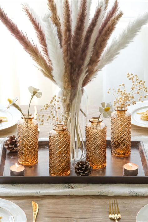 Amber glass flower vases add a touch of vintage elegance to floral arrangements, casting a warm and inviting glow that enhances the natural beauty of any bouquet. This post contains an affiliate link which adds no cost to you. Tiny Bouquet, Vases For Centerpieces, Table Decorations Wedding, Glass Bud Vases, Small Glass Vases, Mini Flowers, Clear Vases, Decor Vase, Exquisite Decor