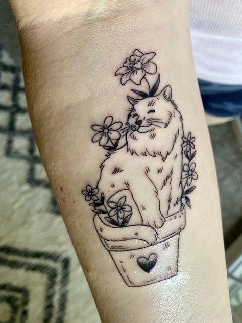 Cat sitting in a flower pot tattoo. Daffodil narcissus tattoo. Cat Holding Flowers Tattoo, Cat And Plant Tattoo, Cat Plant Tattoo, Flower Cat Tattoo, Tattoo Daffodil, Flower Pot Tattoo, Narcissus Tattoo, Pot Tattoo, Cat And Plants