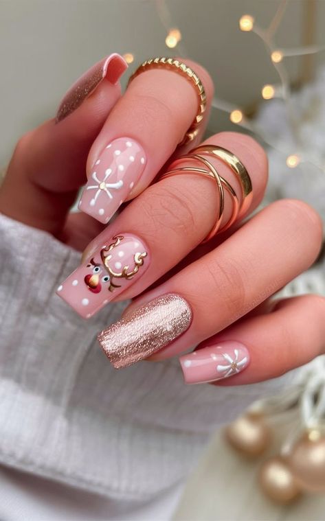 Get into the holiday spirit with these adorable pink nails featuring a playful reindeer, snowflake bows, and shimmering rose gold glitter. The soft pastel shades combined with metallic accents make this design cute and festive for the Christmas season. Glitter Christmas Nails, Simple Christmas Nails, Pink Reindeer, Christmas Nail Ideas, Marble Nail Designs, Christmas Manicure, Manicure Nail Designs, Christmas Nails Easy, Cute Christmas Nails