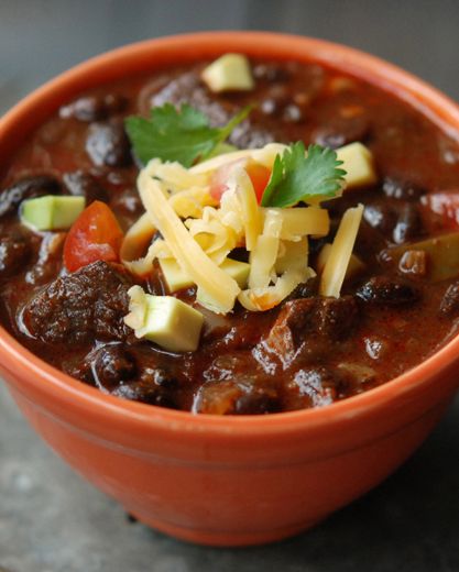 I love making this pork chili on lazy Sunday afternoons. Serve it with limes, chiles, hot sauce, sour cream, avocado, cheddar, corn chips and warm flour tortillas. #recipe Chili Recipe With Black Beans, Pork Chili, Dried Black Beans, Andrew Zimmern, Black Bean Chili, Magazine Recipes, Dark Beer, Bean Chili, Mexican Foods