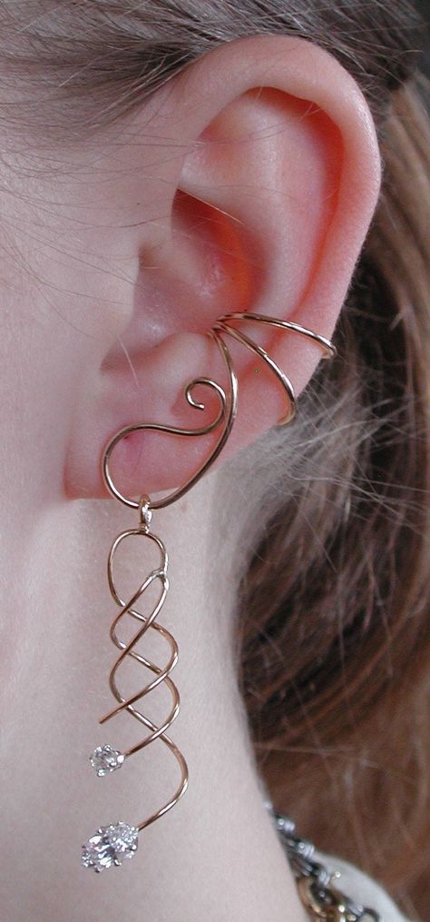 This is our amazing Ear Saver Ear Cuff with a beautiful spiral dangling with Marque Stone from the cuff. This cuff is non pierced and hugs the side of your ear comfortably and securely. The Ear Saver is versatile, you can remove this dangle and add any light weight earring part to hang off of the Ear Saver. If you desire only the Ear Saver Ear Cuff, it is available in a separate listing. This piece will arrive in a Gift Box and include simple fitting instructions. Perfect for gift giving Ear Cuff Diy, Ear Wraps, Wire Ear Cuffs, Minimalist Ear Cuff, Gold Toe Rings, Ear Cuff Jewelry, Wrap Earrings, Wire Jewelry Designs, Gold Ear Cuff