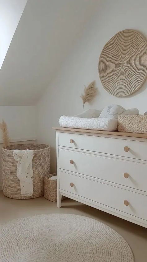 Minimalist neutral nursery with natural textures, soft whites, and wood accents creating a serene atmosphere. White Dresser Nursery, Neutral Nurseries, Nursery Dresser, Baby Nursery Neutral, White Nursery, White Dresser, Neutral Nursery, Girl A, Nursery Neutral