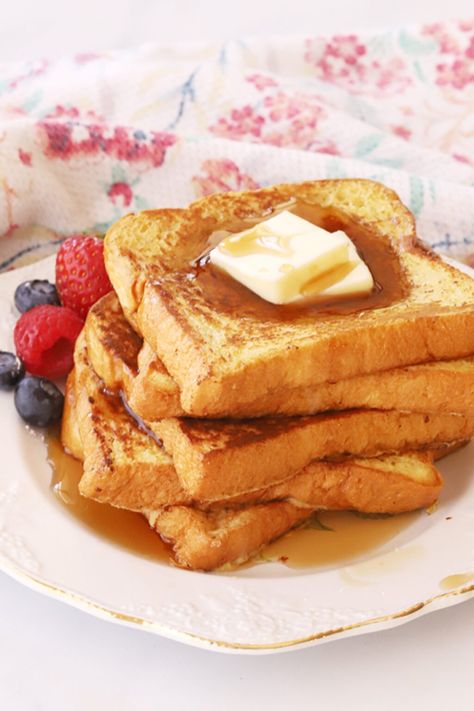 This Classic French Toast Recipe is light, fluffy, and super simple. Lightly sweetened, with just a hint of cinnamon and nutmeg, this accompanies just about any breakfast dish. It tastes great, served solo with maple syrup or with fresh fruit and whipped cream. #thecarefreekitchen #frenchtoast #breakfast #brunch #classic Basic French Toast Recipe, French Toast With Sandwich Bread, French Toast Recipe With Flour, Classic French Toast Recipe, French Toast With Regular Bread, Cinnamon Sugar French Toast Recipe, French Toast Recipe For 2, Home Made French Toast, Breakfast Bits