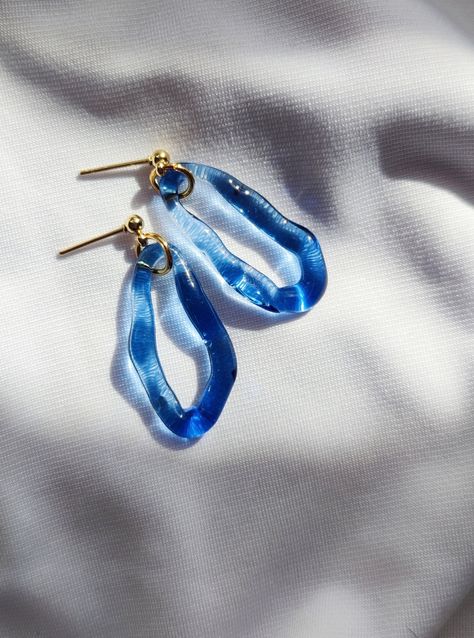 Gorgeous glass earrings in beautiful blue color.  Earrings catch the light beautifully. Perfect for adding an unexpected pop of colour to your everyday essentials. Earrings are made from hard and durable borosilicate glass.  My jewellery is created to strengthen your natural beauty and power. Perfect for sensitive ears because of their lightness and combination with surgical steel (silver or gold) earrings parts. Each piece is handmade in the lampworking techinque, which gives it a unique charac Glass Earrings Handmade, Glass Hoop Earrings, Blue Glass Earrings, Handmade Light Blue Glass Jewelry, Cheap Blue Glass Earrings, Water Earrings, Mermaid Look, Artsy Blue Resin Earrings, Blue Flower-shaped Glass Jewelry