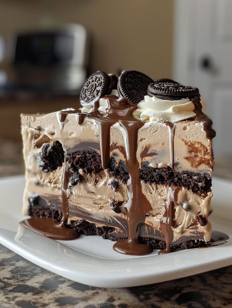 This Mocha Brownie Ice Cream Cake is a delectable treat with layers of coffee ice cream, brownies, Oreo crumbles, hot fudge sauce, and coffee whipped cream icing. It's a wonderful combination that you won’t be able to resist!  Ingredients⤵️  18.4 oz box brownie mix, plus ingredients on box Ice Cream: 2 tbsp warm water 💧 4 tsp instant espresso ☕ 8 oz cream cheese, softened 🧀 1/8 cup milk 🥛 1/2 cup sugar 🍬 1/8 cup Kahlua (optional) 🍹 8 oz Cool Whip (or homemade whipped cream) 🍦 Oreo Snacks, Oreo Ice Box Cake, Box Ice Cream, Coffee Whipped Cream, Brownie Ice Cream Cake, Ice Box Cake, Whipped Cream Icing, Instant Espresso, Chocolate Deserts