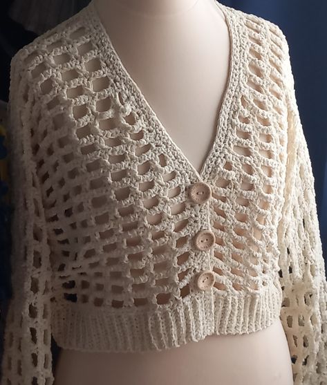 Lightweight chenille cardigan in cream. (MJs off the hook peek a boo pattern) Great pattern to work from. My daughter wanted a lightweight cropped cardigan for the evenings while holidaying on Crete. She had looked everywhere and couldn't find one she liked. She liked the look of this one, so momma came to the rescue and made it for her.  Needless to say, she was extremely happy with it. Chenille Cardigan, Crochet Wearables, Crochet Cardigans, Off The Hook, To The Rescue, Peek A Boo, Cropped Cardigan, Crochet Cardigan, Crete