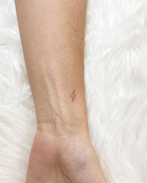 Micro Lightning Bolt Tattoo, Wrist Mini Tattoo, Cute Lightning Bolt Tattoo, Mini Tats Wrist, Small Tattoos Lightning Bolt, Lightning Bolt Stick And Poke, Small Lightning Bolt Tattoo Finger, Lightning Wrist Tattoo, Fine Line Tattoo On Finger