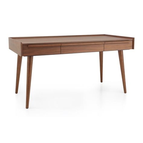 Our 1960s-inspired Tate desk recalls the timelessness of mid-century design with a tailored profile and streamlined shape. Crafted of solid walnut and walnut veneer, the desk showcases three drawers united by linear undercut drawer pulls that run the length of the desk.     Designed by Blake Tovin of Tovin Design   Solid walnut, engineered wood and walnut and hardwood veneer with natural walnut finish, sealer and topcoat   3 solid poplar drawers   Ball bearing side mount extension glides   Under Walnut Gaming Desk, Mid Century Office Desk, Modern Wood Desk, Moody Design, Modern Home Office Desk, Wood Office Desk, Mid Century Office, Mid Century Modern Office, Walnut Desk