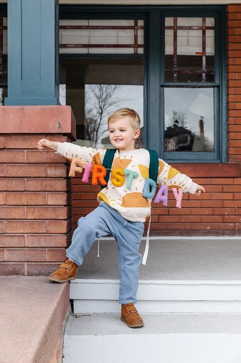 Bring a unique, playful touch to back-to-school season with the First Day Felt Garland! Sustainably made of 100% wool and adjustable letters, this colorfully crafted garland is perfect for capturing your child's first day of school. Plus, it comes with a ready-to-hang kit and reusable packaging for safekeeping and gifting. It's the perfect size for little hands to hold, so you can create a special photo prop and decor. Let's get schoolin'!  Letters measure approximately 4 inches high String meas Baby Birthday Crown, Felt Garlands, Last Day Of School Sign, First Day Of School Sign, Felt Banner, Reusable Packaging, School Banner, Felt Garland, 1st Day Of School