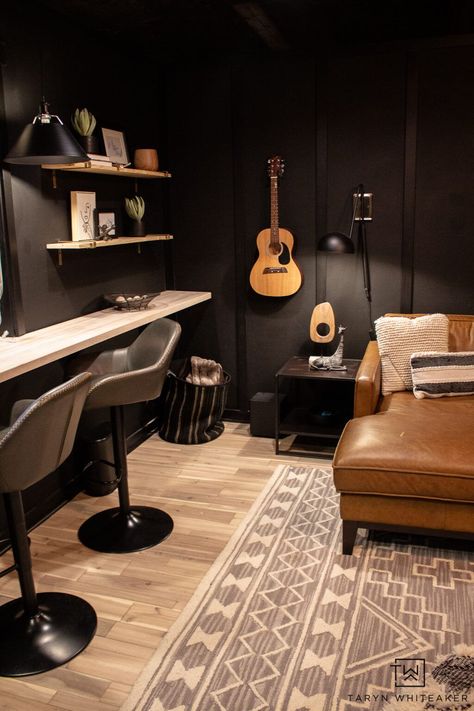 Tour this moody lounge space. Perfect for game nights or tv marathons. The cozy modern style is such a vibe. Black Music Room Ideas, Moody Guitar Room, Music Gaming Room, Gaming Music Room, Vibey Music Studio, Music Studio Lounge, Gaming And Music Room, Basement Music Room Ideas, Music Lounge Room Ideas