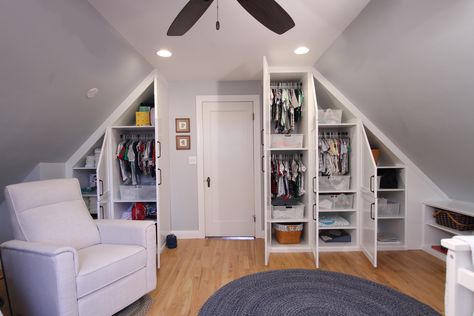 This client emailed to tell me how much she LOVES her custom painted wood cabinetry! "I knew I would love them, but they exceeded my expectations." Before, this was an upstairs room with a slanted ceiling and NO closet. Now she has a place for everything in her baby's new nursery. Awwww. 💗  #nursery #builtins #closedstorage #woodcabinetry #wardrobecabinets #functional #bookshelf #woodproject #beautifulspaces #designer #aplaceforeverything #closetgoals #newspace Contact: MelissaM@NewSpace.com Closet Ideas With Slanted Ceiling, Minimalist Bedroom Slanted Ceiling, Nursery With Slanted Walls, Low Vaulted Ceiling Bedroom Attic Rooms, Long Narrow Attic Bedroom, Slop Ceiling Bedroom Ideas, Attic Bedroom Slanted Ceiling, Upstairs Room With Slanted Ceiling, A Frame Closet Ideas