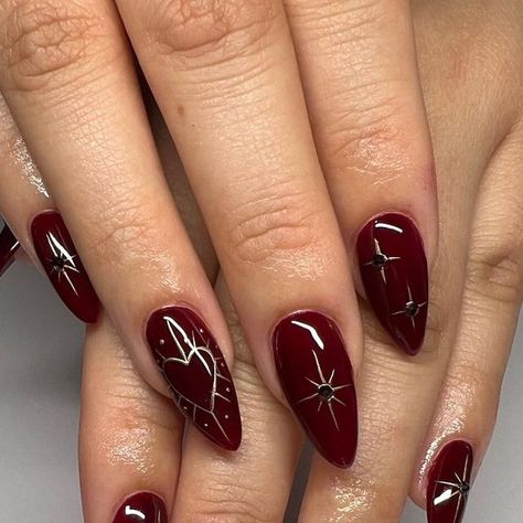 Shantal Saba on Instagram: "🍷✨ . . . .  #nails #nailsart #nailsdesign #nailinspo #nailideas #winternails #winternailart #christmasnails #christmasnailart #holidaynails #newyearsnails #chromenails #chromestarnails #darkrednails  #winerednails" Hadestown Nails, Dark Red Fall Nails Design, Saltburn Nails, Red Witchy Nails, Alternative Christmas Nails, Brookie Pie, Christmas Nails 2024, Almond Shaped Christmas Nails, Yule Nails