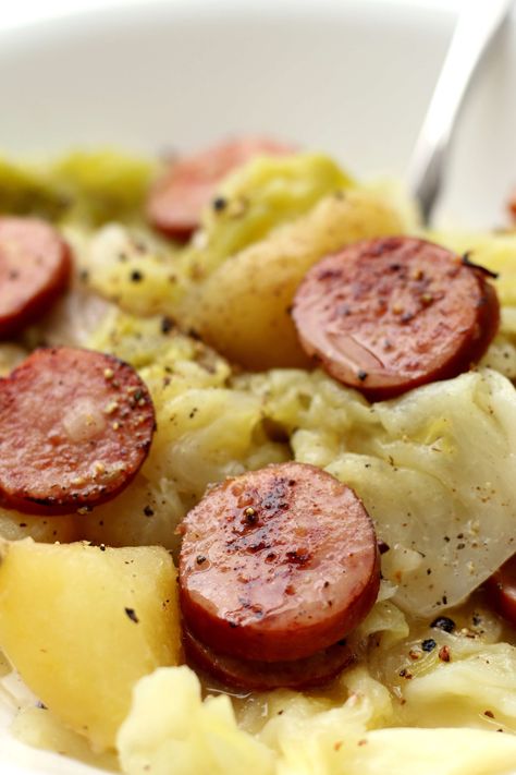 Slow Cooker Smoked Sausage and Cabbage—an easy all in one pot meal of smoked sausage, potatoes, onion and cabbage. Dump everything into the crock and walk away! #slowcooker #crockpot Crockpot Cabbage And Sausage, Instant Pot Smoked Sausage, Outlander Food, Smoked Sausage And Cabbage, Cabbage Burger, Crockpot Summer, Sausage Casseroles, Kielbasa Potatoes, Burger Casserole