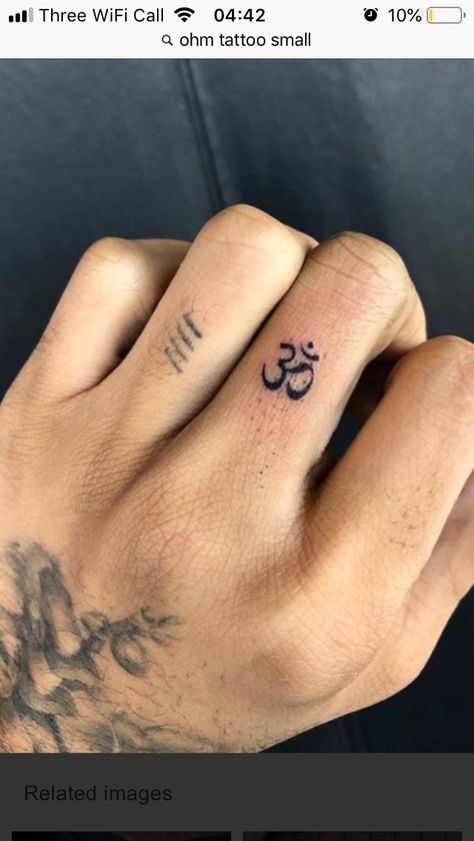 Indie style ohm tattoo on finger Ohm Finger Tattoo, Mini Om Tattoo, Om Face Tat, Small Ohm Tattoo Design, Om Finger Tattoos, Ohm Tattoo For Men, Ohm Tattoo Small, Ohm Tattoo Design, Aum Tattoo