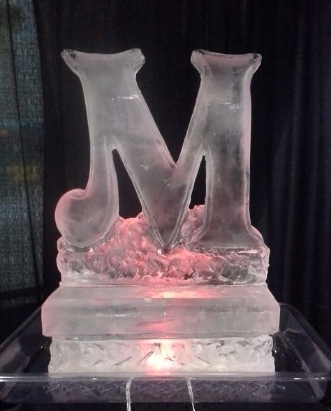 1/2 block Monogram "M" for a wedding at the Renton Civic Center. 50th Birthday Ice Sculpture, Sweet 16 Ice Sculpture, Wedding Reception Ice Sculpture, Swan Ice Sculpture Weddings, Ice Sculptures Wedding, Crystal Wedding Decor, Candy Land Decorations, Swan Ice Sculpture, Ice Sculpture Wedding