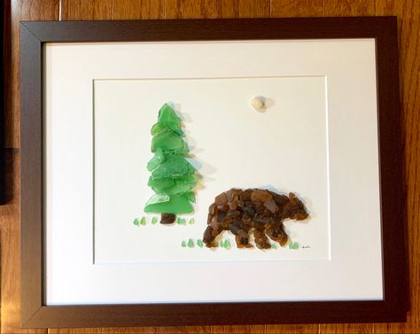 Beach glass wall art. Bear and tree. Beach Glass Art Pictures, Glass Rocks Crafts, Brown Sea Glass Crafts, Sea Glass Mountain Art, Sea Glass Art Tree, Giraffe Sea Glass Art, Beach Glass Art Animals, Brown Beach Glass Art, Bear Sea Glass Art