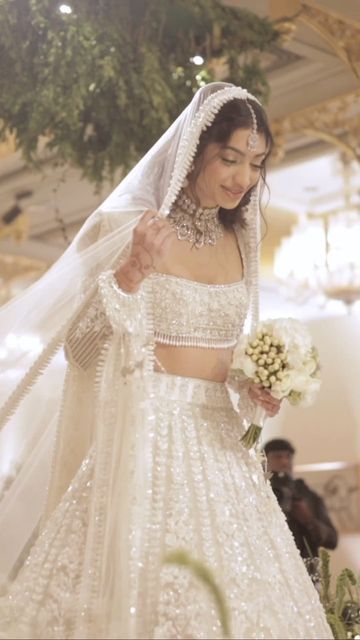 Wedding Vows Magazine on Instagram: "Elegance personified - Alanna Panday in that breathtaking white lehenga taking graceful stepping down the aisle in a sea full of emotions and white petals 🥺😍 Visit www.weddingvows.com for more content and region based vendors. #weddingvows #weddingvowsmagazine #weddingdecor #weddingphotography #weddingdress #weddingcake #weddingideas #alanapandey #bollywoodwedding #alanna #alannapanday" Alanna Panday Wedding Lehenga, Alanna Panday Wedding, White Lehenga, Bollywood Wedding, Love Animation Wallpaper, Wedding Lehenga, Wedding Vows, Garden Statues, Lehenga