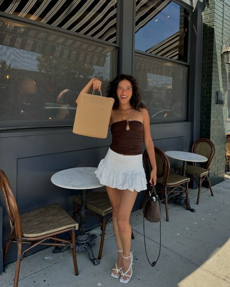 something new⋆˙⟡♡ @peppermayo Summer fashion, Casual chic, Outdoor café vibes, Minimalist style, White skirt outfit, Brown tube top, Strappy heels, Fashion inspiration, Natural curls, Sunlit afternoon, pinterest girl style, pinterest aesthetic #SummerStyle #EffortlessChic #StreetStyle #transitionalstyle #MinimalFashion #CurlyHair #CafeLife #styleinspiration #carriebradshawstyle #pinterestinspired Brown Tube Top Outfit, Style White Skirt, Brown Tube Top, White Skirt Outfit, Carrie Bradshaw Style, Top Cafe, White Skirt Outfits, Tube Top Outfits, Style Pinterest