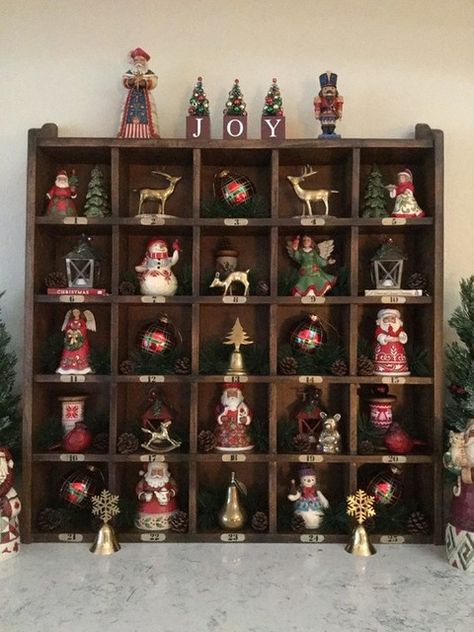 Christmas Cubby Decorations, Shelve Christmas Decoration, Christmas Figurines Display, Christmas Shelves, Christmas Curiosity Cube, Vintage Cubby Display, Santa Mug Collection Display, Christmas Bookshelf, Pinterest Christmas Crafts