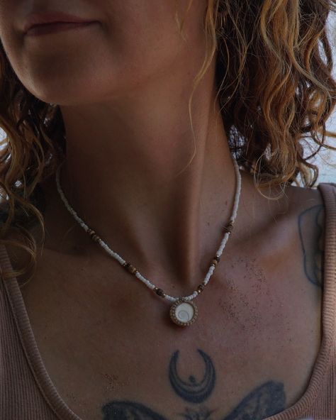 The Shiva Eye Shell represents wisdom, protection, and the flow of life 🌊 Our all new unisex Shiva Eye Beaded Necklaces can be worn on both sides, come in white or black, and are handmade with coconut & shell beads, bringing all the tropical beachy vibes to your everyday look 🐚🏝️🥥 Shop online now at www.jaiyen.store 🌞 . . . #handmadenecklace #handmadejewelry #handmadejewellery #handmadejewelrydesign #bohojewelry #beachjewelry #summerjewelry #summerjewellery #summernecklace #beachnecklace #b... Flow Of Life, Shiva Eye, White Beaded Necklaces, Beachy Vibes, Beach Necklaces, Spiral Pattern, Summer Necklace, Handmade Jewelry Designs, Coconut Shell