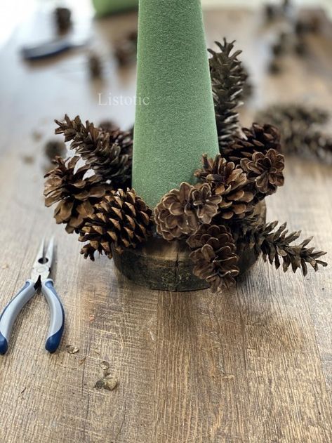 DIY Pine Cone Christmas Tree Craft ⋆ Listotic Christmas Trees Made Out Of Pine Cones, How To Make A Pine Cone Christmas Tree, Pine Cone Tree Craft, Diy Pine Cone Christmas Tree, Pine Cone Trees Christmas, Christmas Pine Cone Wreaths Diy, Pine Cone Christmas Tree Diy, Pine Cone Trees Diy, Pinecone Trees Diy