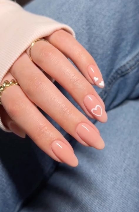 25 Trendy Valentine's Day Nails We're Crushing On (2024 edition) Nail February 2024, Trendy Minimalist Nails 2024, Simple Heart Design Nails, Oval Nails Designs Valentines, Nails February 2024, February Nails Red, Heart Nails Simple, Nail Shape Acrylic, Simple Heart Nail Designs