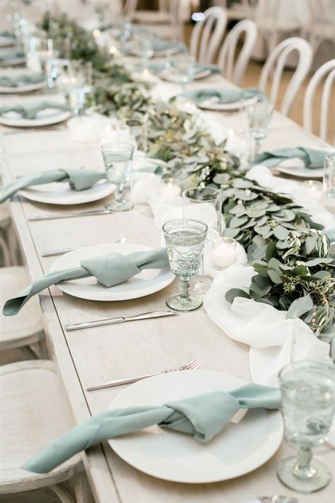 How beautiful is this muted seafoam green table setup?! The simple knotted napkins match perfectly with these gorgeous intricate goblets and the garland running down the middle of the table pulls it all together. #receptiontableideas #weddingreception #weddingtable Seafoam Green Wedding, Green Wedding Reception, Seafoam Wedding, Glass Table Decor, Sea Glass Wedding, Wedding Table Setup, San Luis Obispo Wedding, Green Napkins, Green Themed Wedding