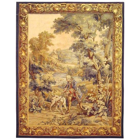 A French hunting tapestry from the late 19th century, envisioning a scene in which a nobleman leads his hound through a verdant area in search of the day’s hunt, with a stately tree at right and a pond and rolling hills in the background. Enclosed within a trompe l’oeil frame border. Wool with silk inlay. Measures: 8’0” H x 6’1” W Hanging: The tapestry comes ready for hanging, with linen backing and a strip of hook and loop tape at the top end, which can be connected to the opposite side of the Tapestry Cushion, French Walls, Tapestry Wall Art, Louis Xiv, Tapestry Weaving, Hanging Tapestry, Traditional Rugs, Hanging Wall Art, Tapestry Wall Hanging