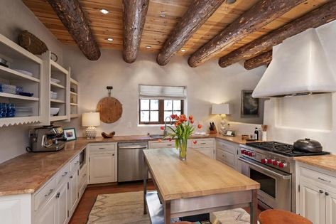 Photo 6 of 14 in This Classic Pueblo-Style Home in Santa Fe, New Mexico Could Be Yours for $2.3M - Dwell Painted White Kitchen Cabinets, New Mexico Style Home, Painted White Kitchen, New Mexico Style, Paint Cabinets White, Sub Zero Appliances, Mexico Style, Santa Fe Style, Brick Flooring