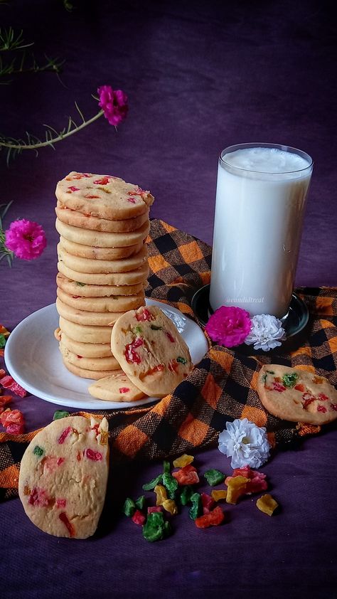 Tutti Frutti cookies are popular Karachi biscuits. The ingredients of this recipe are very easy to find. You need some all-purpose flour, unsalted butter, sugar, and tutti frutti. You can also make your own homemade tutti frutti or you can use store-bought. #candidtreat #cookies #foodphotography #indianrecipes #tuttifrutticookies Karachi Biscuits, Cookies Eggless, Eggless Cookie Recipes, Cookie Dough Ingredients, Eggless Cookies, Custard Powder, Using A Pressure Cooker, Cookie Videos, Unique Cookies