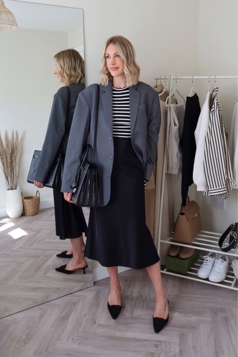 Office work wear outfit idea - grey blazer, Breton stripe and satin slip skirt (bag and shoe alternative linked below) Follow my shop @charlottebuttrick on the @shop.LTK app to shop this post and get my exclusive app-only content! #liketkit #LTKworkwear #LTKshoecrush #LTKitbag @shop.ltk https://liketk.it/3OKK2 Blazer And Midi Skirt Outfits, Slip Skirt Office Outfit, Grey Blazer Skirt Outfit, Midi Skirt Blazer Outfit, Silk Skirt Office Outfit, Slip Skirt Work Outfit, Black Satin Skirt Outfit Work, Grey Satin Skirt Outfit, Stripe Blazer Outfit