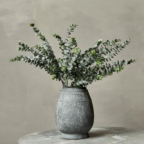 Available From End of October We adore eucalyptus, its one of the most versatile of foliages , looks amazing all by itself or compliments other botanicals so well. Also takes us through the seasons- beautiful with winter whites Dimensions: 84 cm We've been hugely inspired by all things foraged and wild this season. Eucalyptus Decor Home, Filled Vases, Hyper Real, Abigail Ahern, Rustic Vase, Hand Painted Fabric, Flower Collection, Meadow Flowers, Large Plants